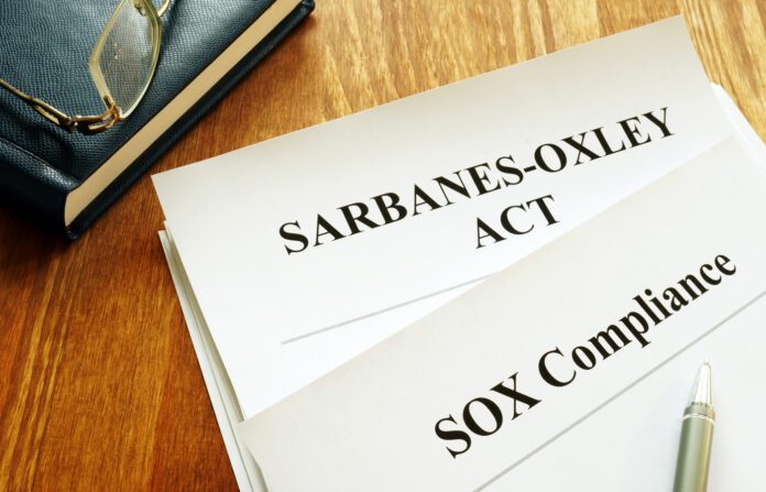 Sarbanes-Oxley Act and SOX compliance policy on table.