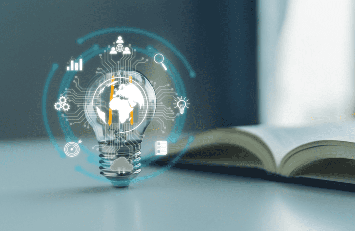 Light bulb with virtual knowledge-related icons connected by a circuit with a textbook on the background.